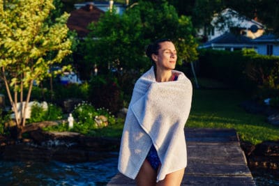 Girl wrapped in towel after swimming.
