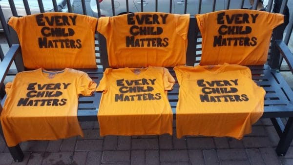 National Day of Truth and Reconciliation and Orange Shirt Day with "Ever Child Matter" written on them. 
